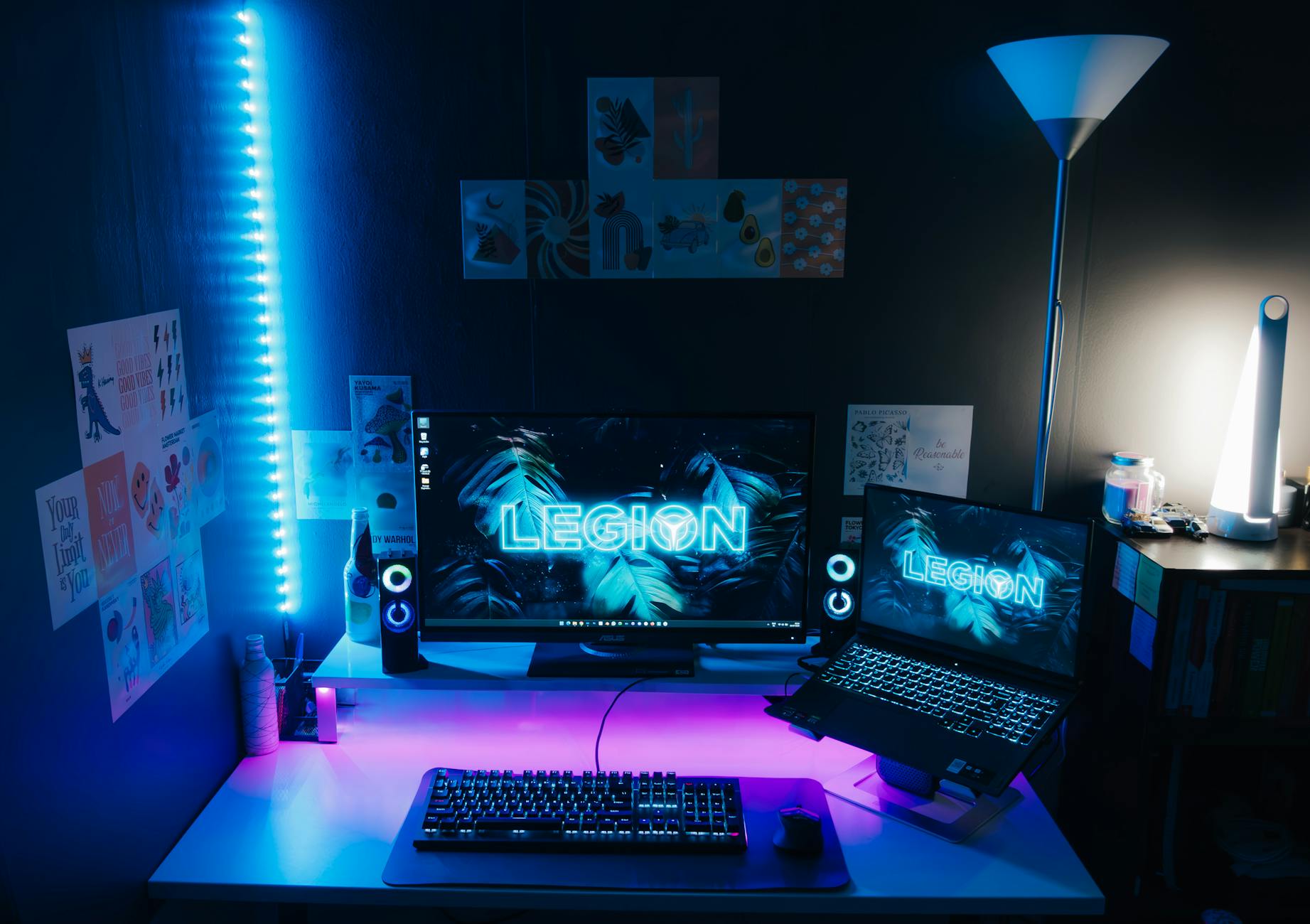 A sleek, modern gaming setup featuring vibrant LED lighting and dual monitors.