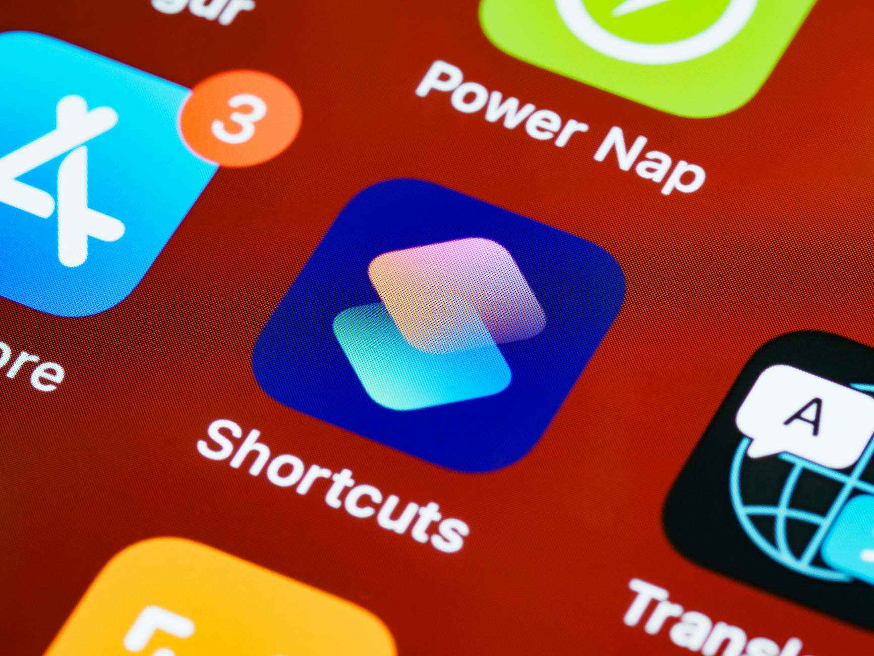 Detailed close-up of smartphone home screen displaying app icons like Shortcuts and Power Nap.